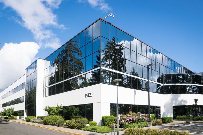 Modern glass office building representing the Charlotte metro business market